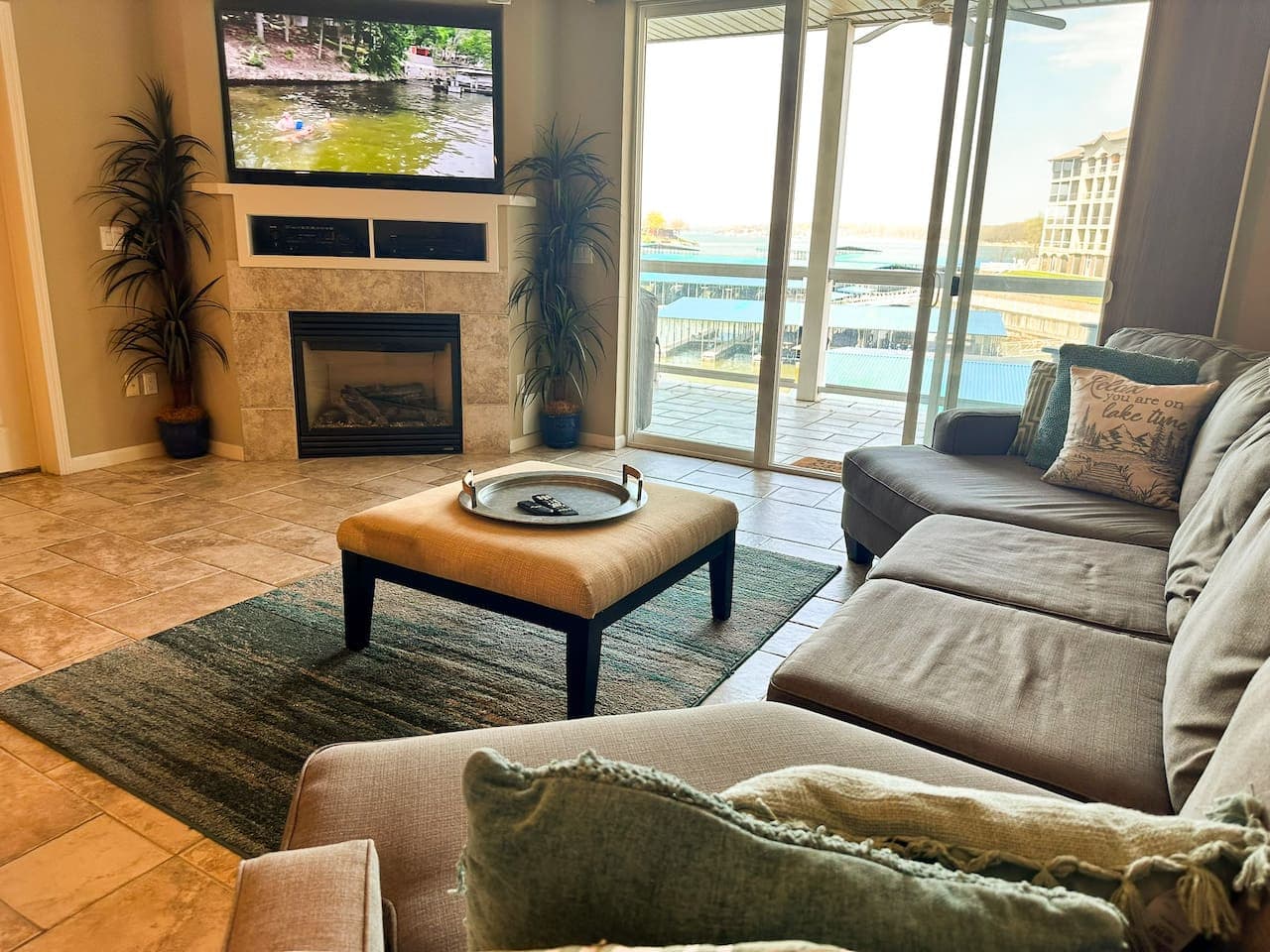 This cozy seating area is perfect for relaxing with a cup of coffee from the nearby station, featuring a comfortable sectional sofa with plush cushions. Enjoy a good book or engaging conversation in this inviting space, designed for ultimate comfort