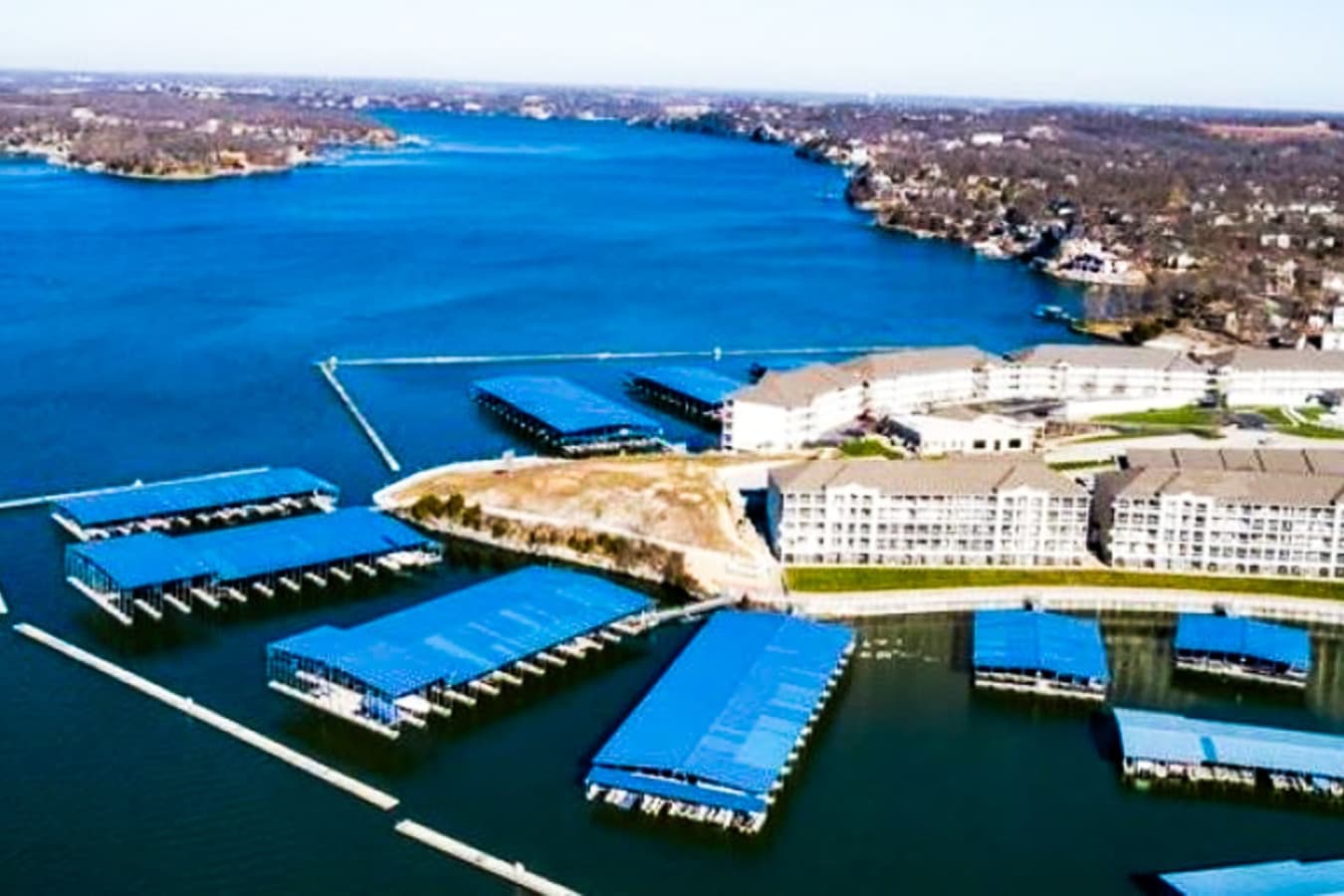 This top-floor condo offers breathtaking panoramic views of the lake, featuring a wide expanse of sparkling water and surrounding greenery. The private balcony provides an ideal vantage point for enjoying the stunning scenery, perfect for a relaxing