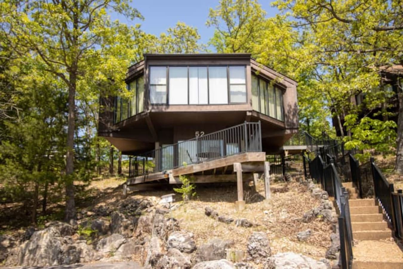 Perched on the hillside, Treetop Unit 52 blends comfort and nature just minutes from the lake and pool.