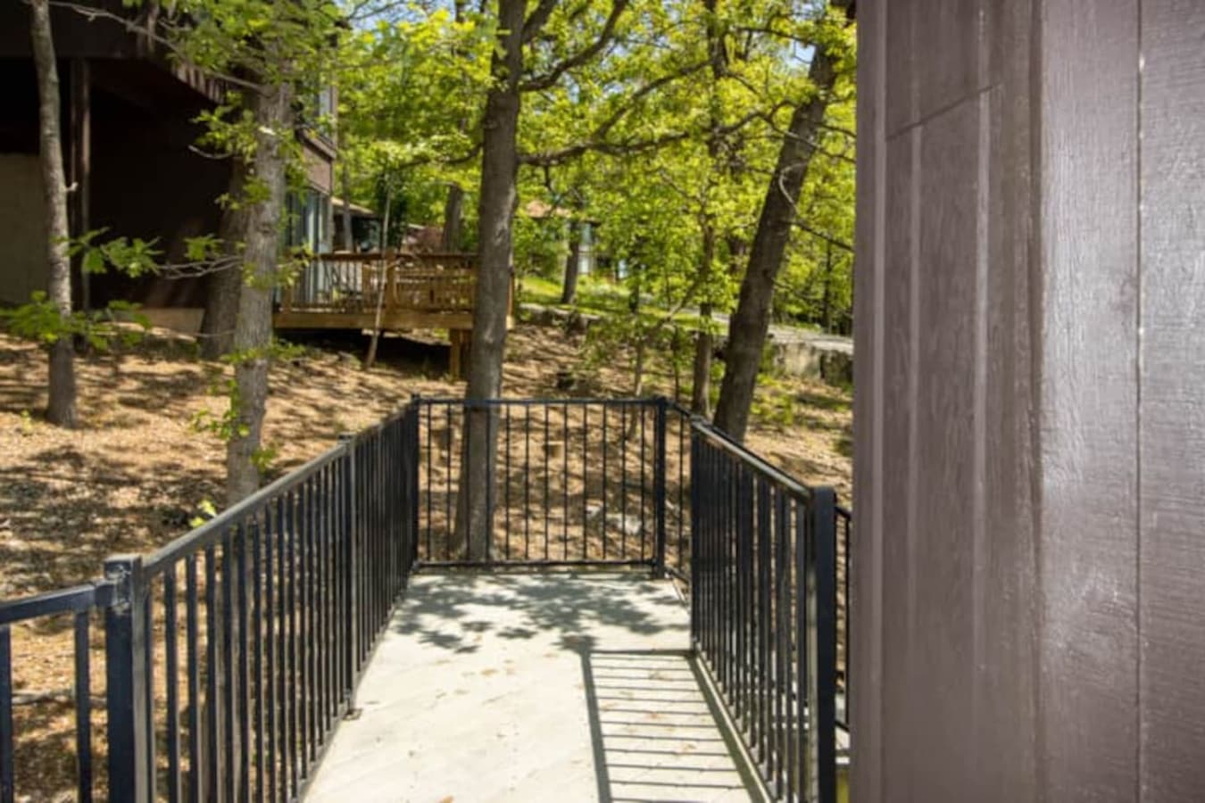 Tucked into the trees, the path to Unit 52 sets the tone for a serene stay.