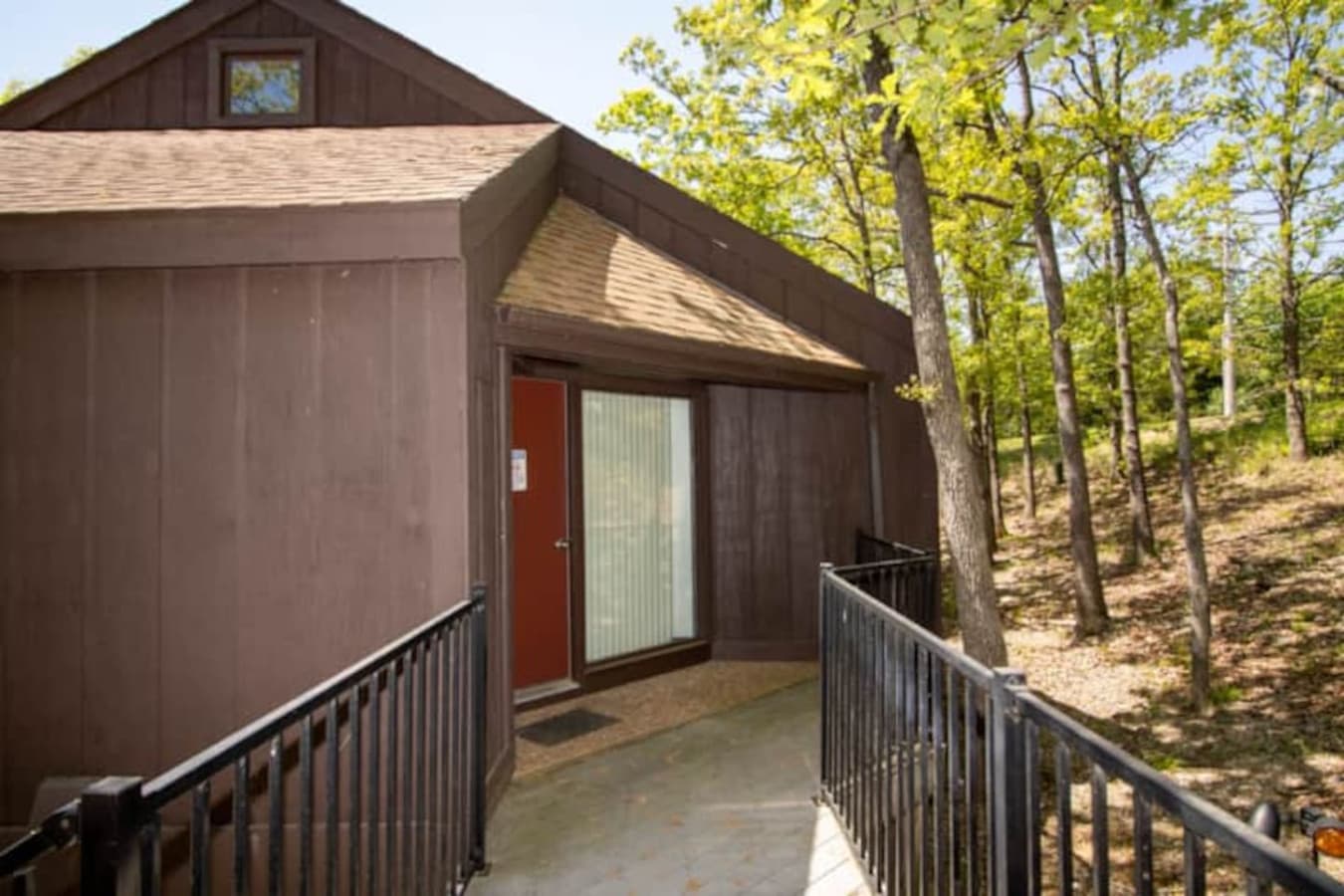 A warm welcome awaits—private path to your hillside hideaway in Treetop Village.