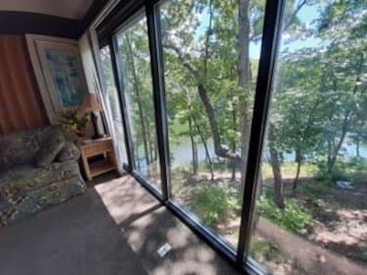 Immerse yourself in nature! Stunning views of the lake and lush trees are your daily backdrop from this inviting space.