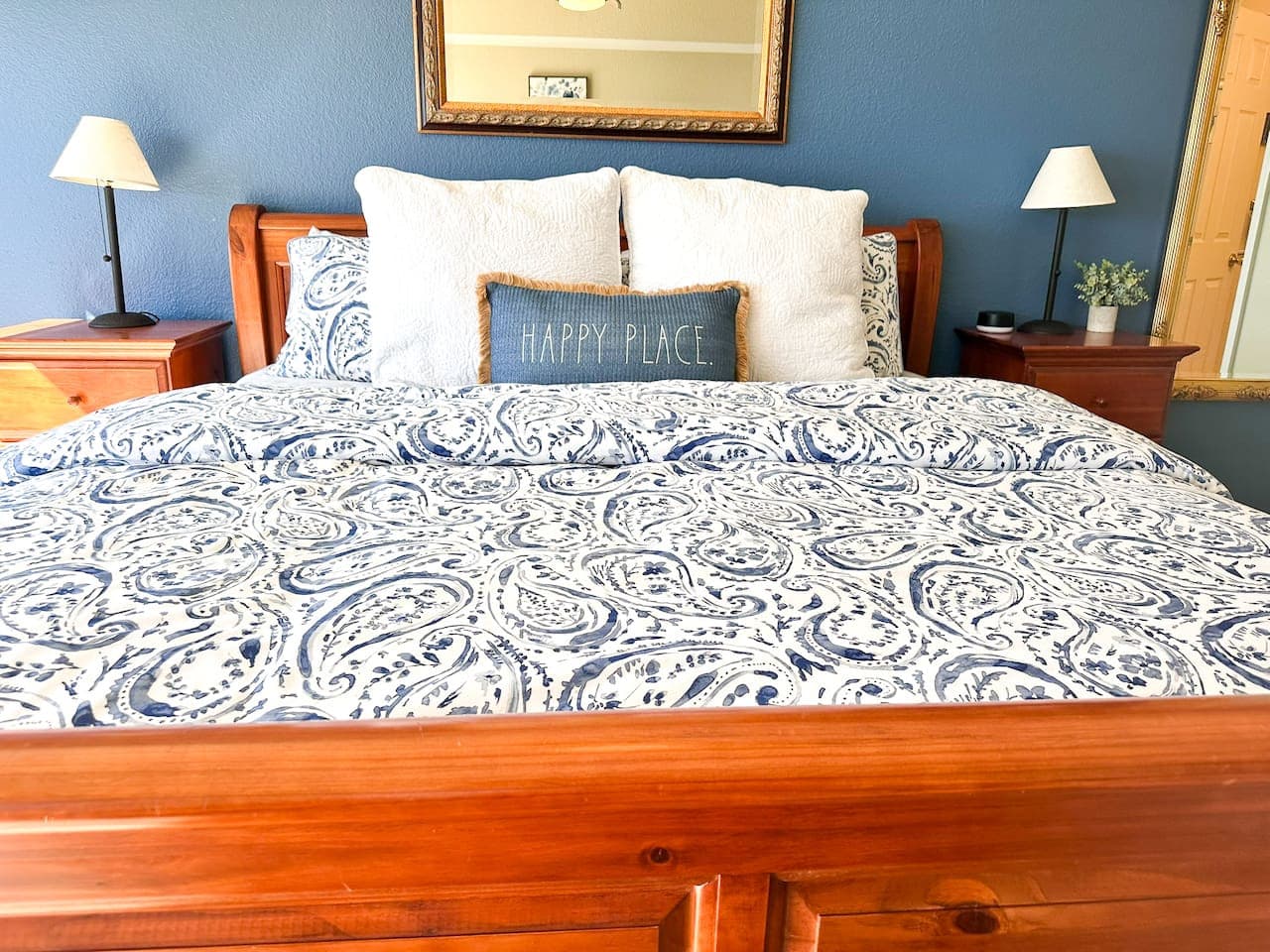 A stunning master suite with large windows that let in natural light and offer a breathtaking view of the lake.