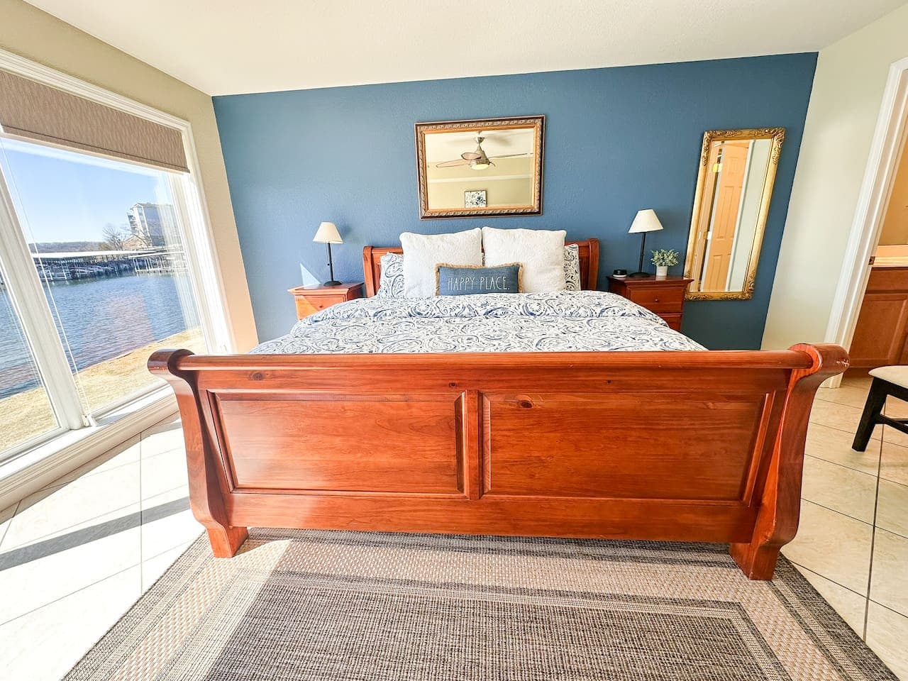 Elegant bedroom decor with a classic wooden bed frame, luxurious bedding, and a welcoming atmosphere.