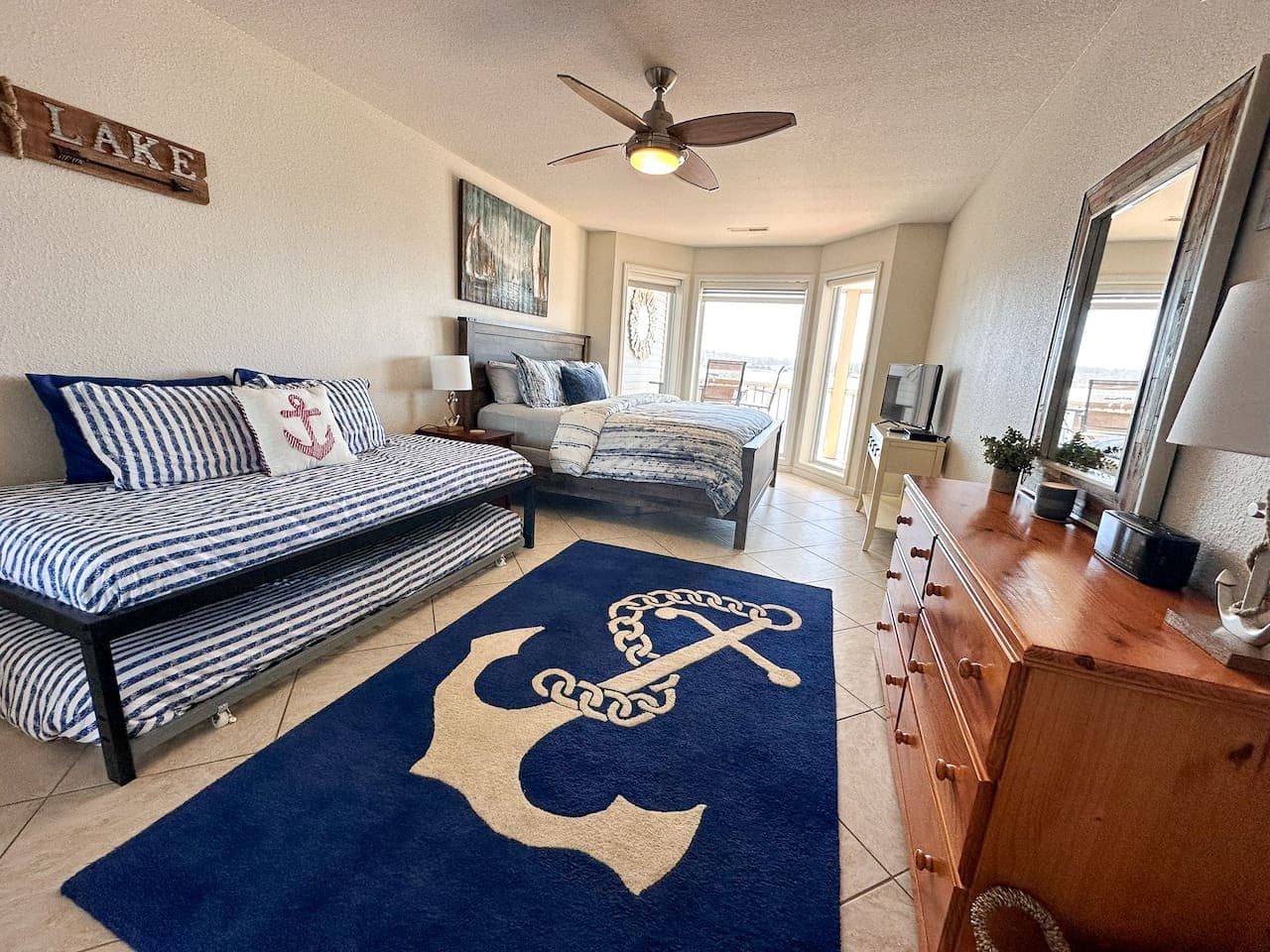 A beautifully designed bedroom with a mix of comfort and elegance, complete with lake views and a cozy atmosphere.