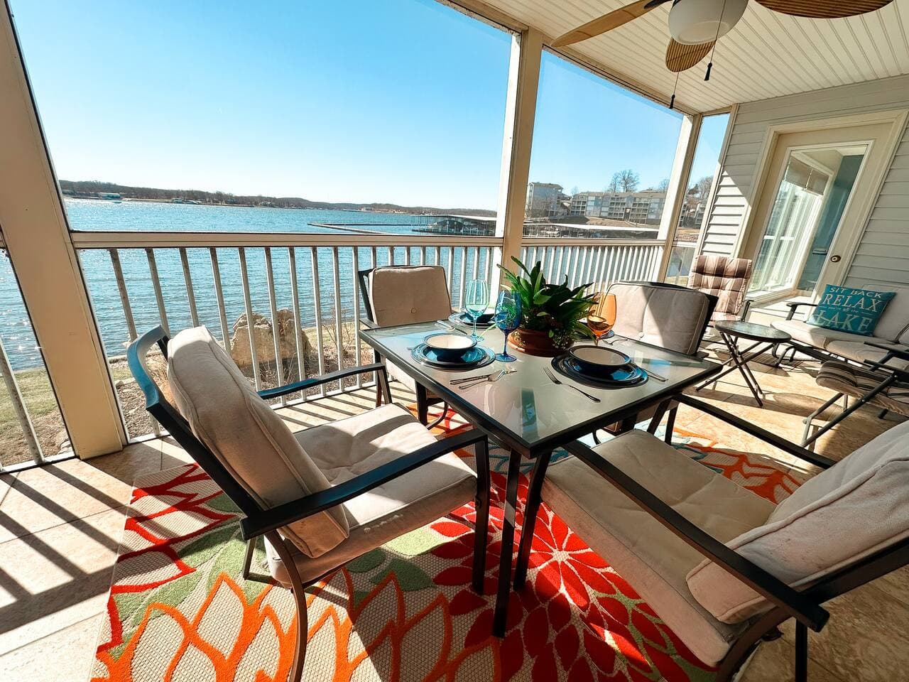 A picturesque patio setup overlooking the lake, where you can enjoy meals with a refreshing breeze.