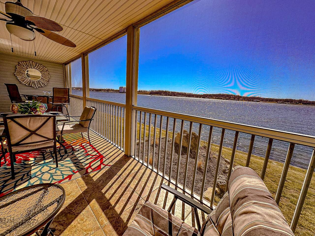 Relax on the spacious patio and take in stunning views of the lake, perfect for unwinding.