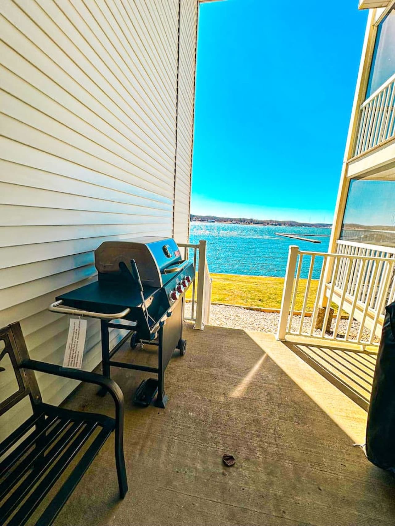 Step outside to your private deck featuring a BBQ grill and seating area with direct views of the lake. Enjoy grilling while watching the sunset or sipping your morning coffee with a serene water view.