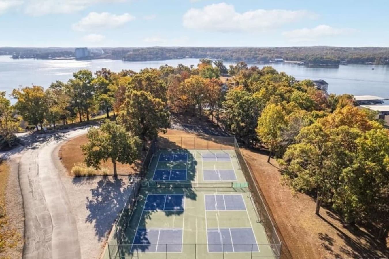 Stay active with well-maintained courts overlooking the serene lake setting.