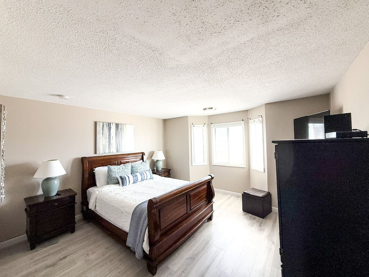 Master suite featuring a plush queen bed and a private en-suite bathroom—your personal retreat for comfort and relaxation.