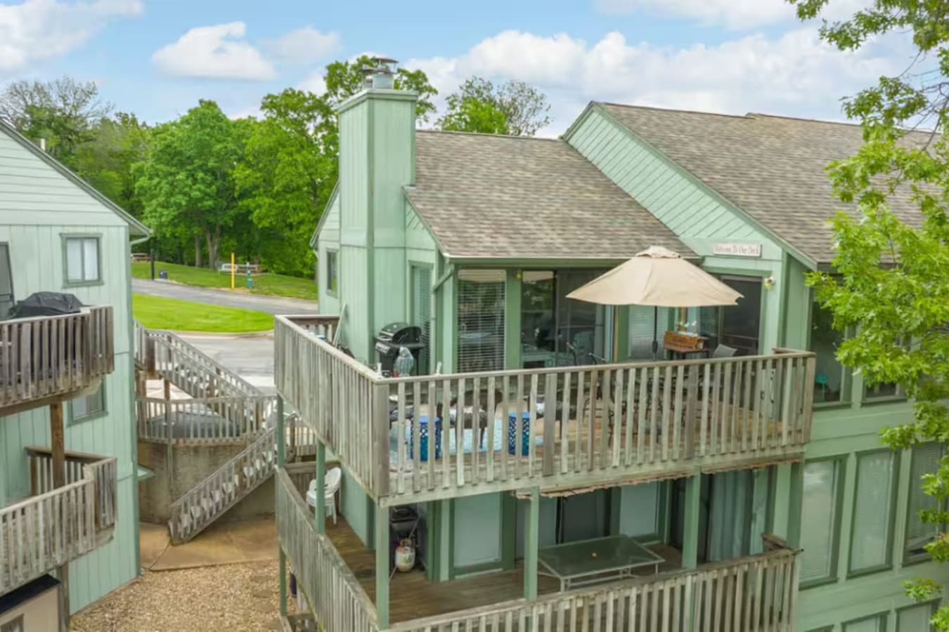 This beautiful one-story condo boasts a large deck that invites outdoor gatherings and peaceful views.