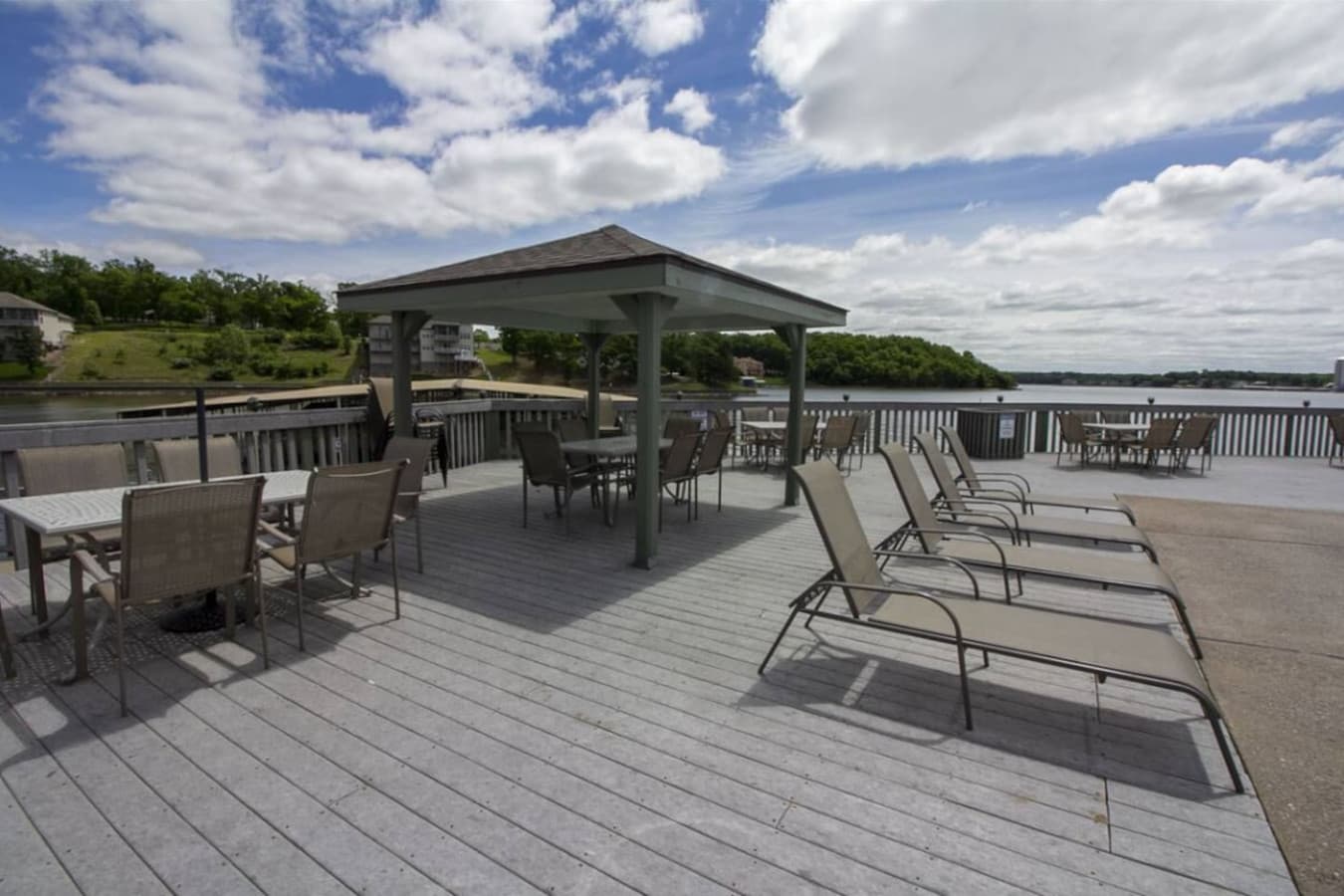 Enjoy peaceful moments poolside with seating arranged to take in the lake’s beauty.