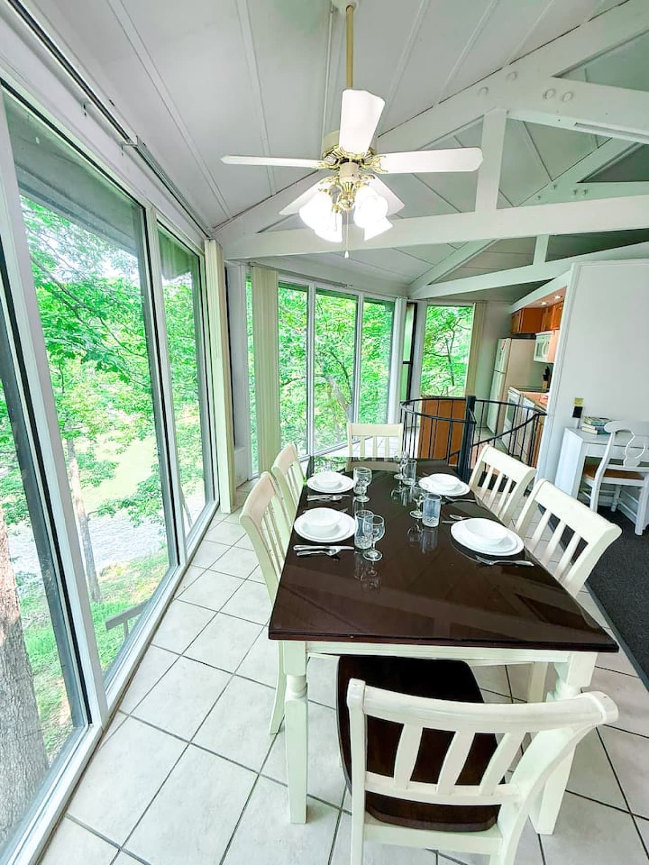 Gather, eat, and connect in a cozy dining space surrounded by the calming sights of the forest.