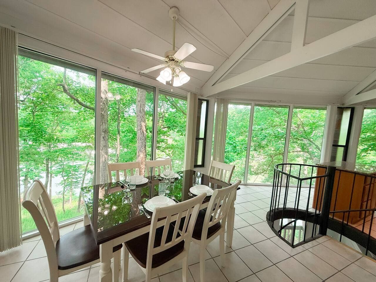 Floor-to-ceiling windows bring the outdoors in—your dining area with a front-row seat to nature.