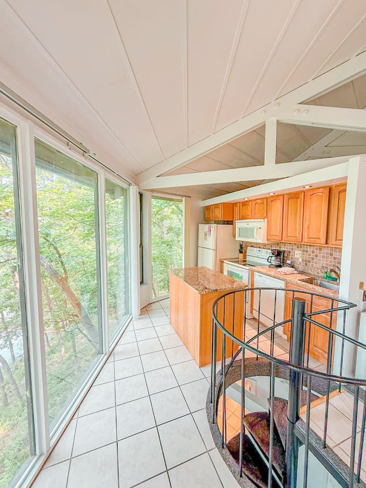 Cook with a view—this kitchen offers stunning tree-lined scenery to enjoy with every meal prep.