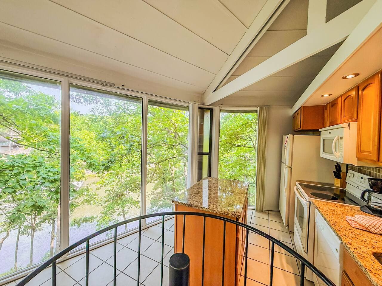 Surrounded by nature, the kitchen is as calming as it is functional—perfect for slow mornings and sunset snacks.