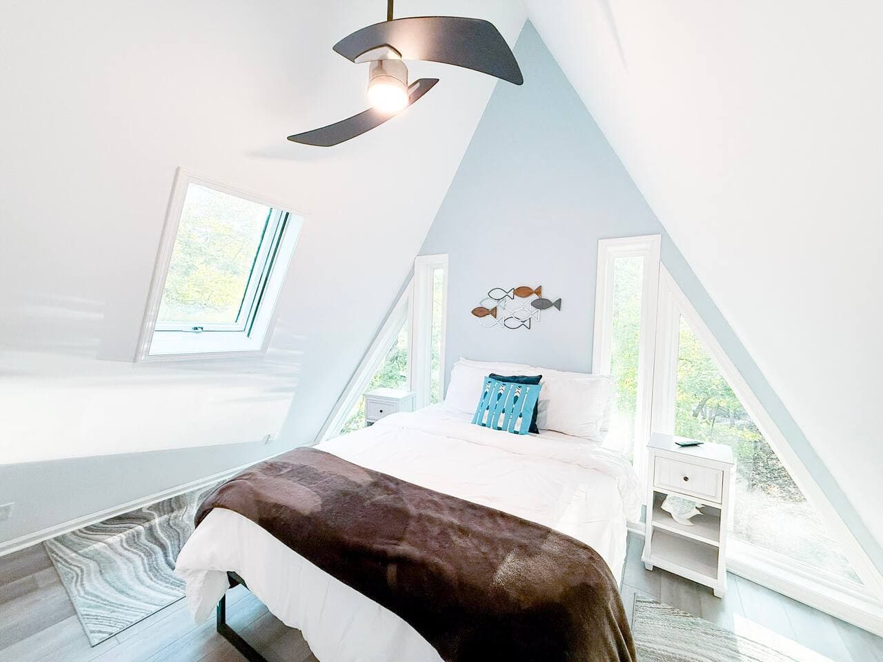 Upper level bedroom is pure relaxation with luxury linens and treetop views.