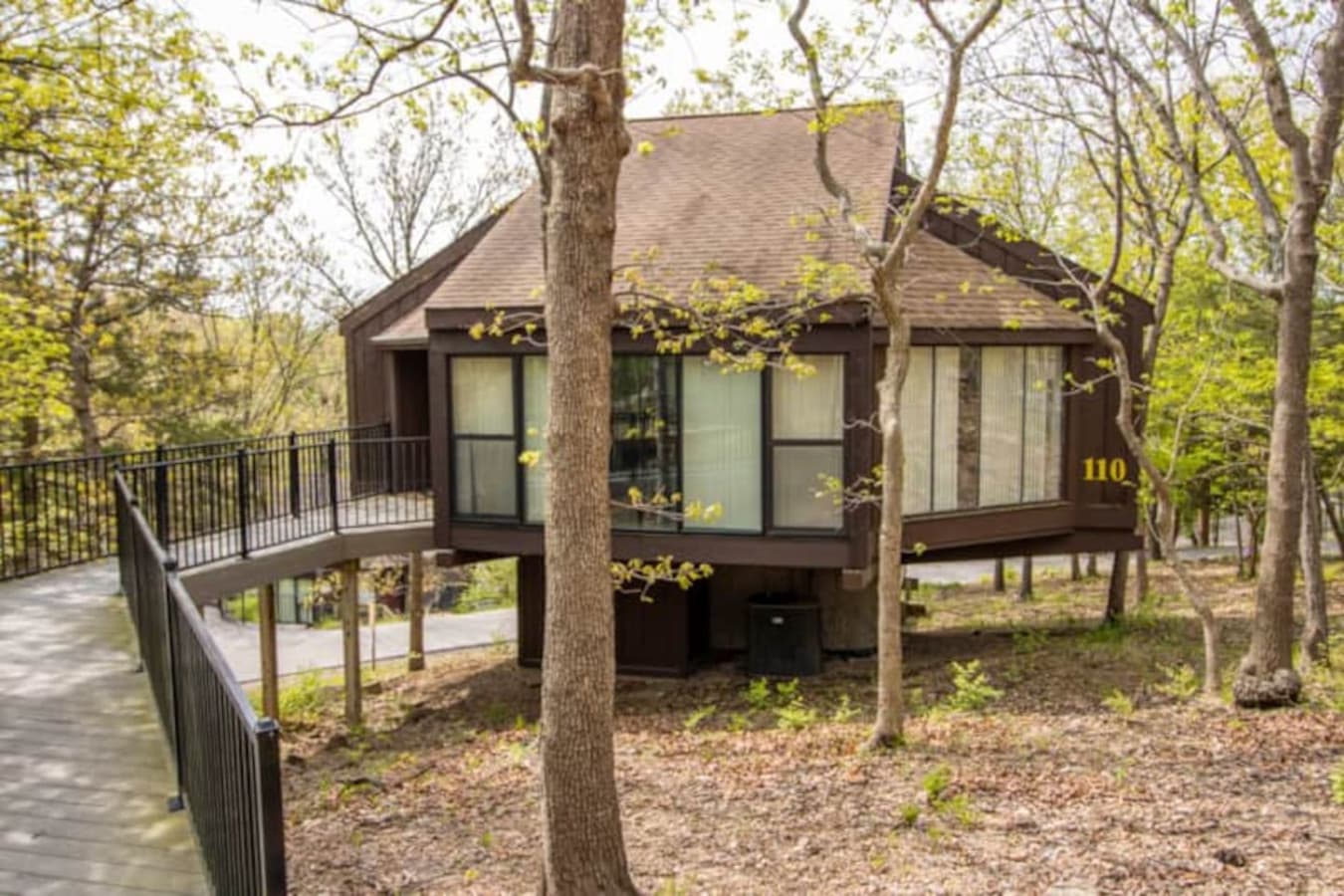 "Discover your peaceful retreat! Treetop Villa 110 is nestled among the trees, offering a serene escape and unique architectural style."