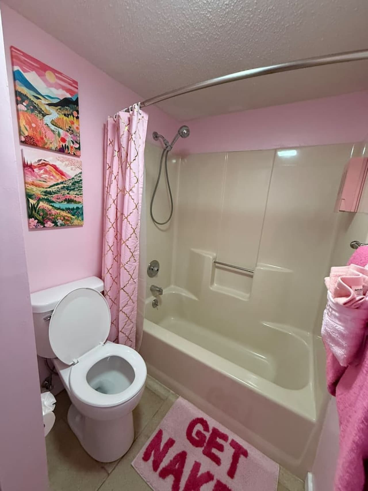 Second bathroom offers a shower and tub combo