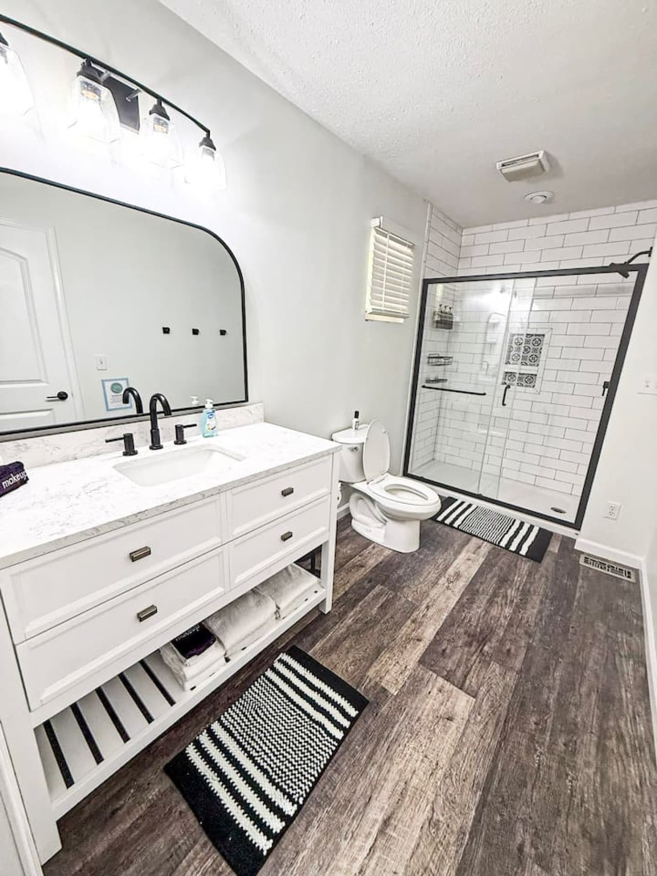 Modern bathroom with walk-in shower and stylish finishes.