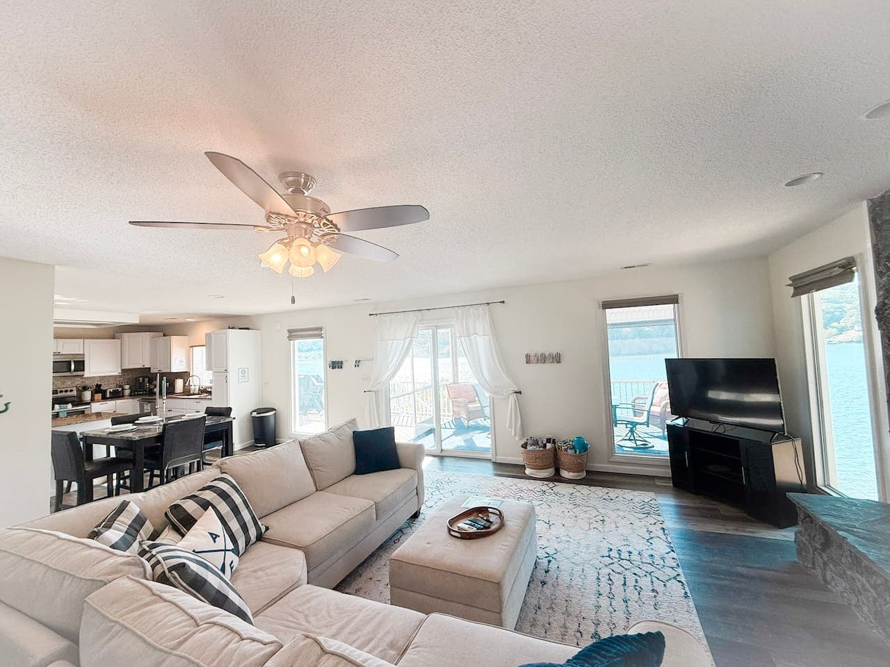 Spacious living area with lake views and natural light.
