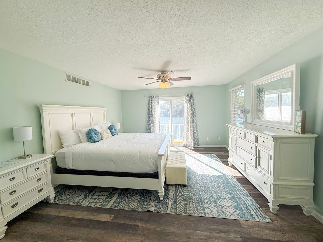 Spacious master bedroom with natural light and views.