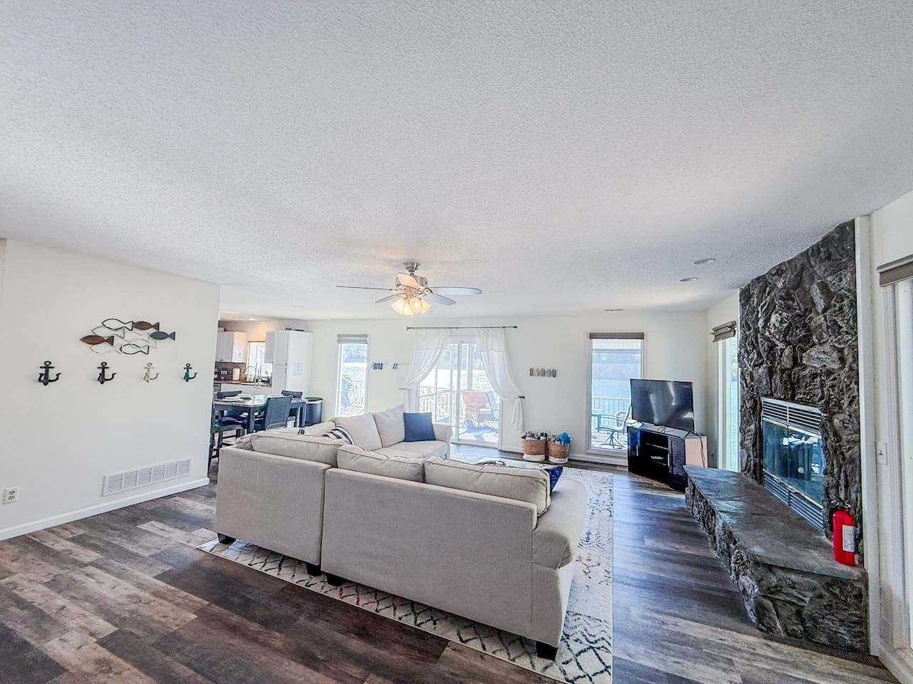 Spacious living area with lake views and cozy seating.