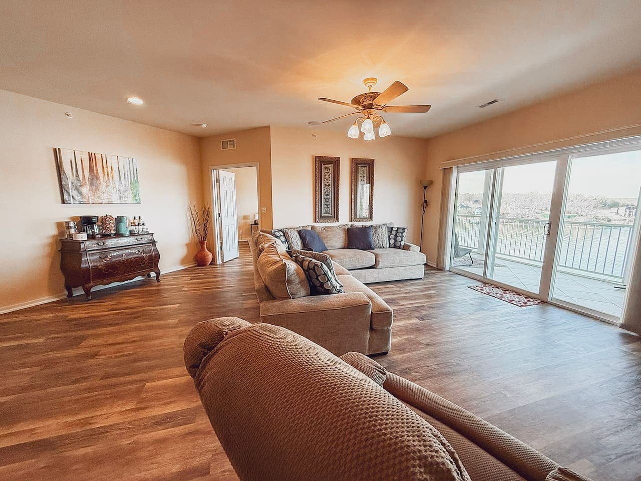 Stretch out and unwind in this spacious living area, filled with natural light and comfortable seating for the whole group.