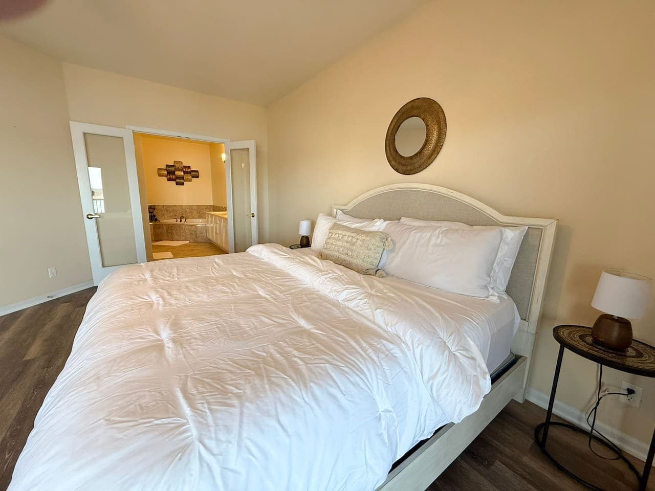 Unwind in this serene bedroom featuring a plush king bed, crisp linens, and a calm, inviting design.
Perfect for restful nights after a day on the lake, this cozy retreat delivers comfort, space, and a peaceful stay.