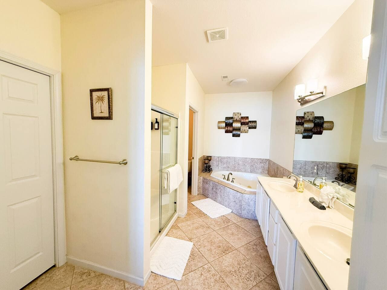 Enjoy a spacious spa-style bathroom with a soaking tub and walk-in shower, perfect for unwinding after a day at the lake.