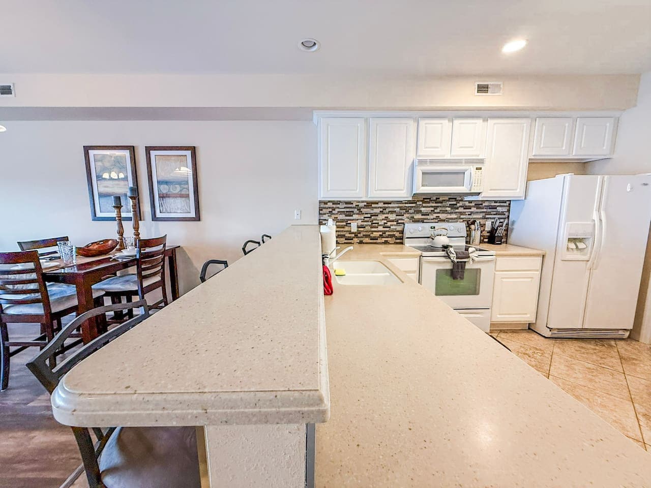 Cook, dine, and connect in this spacious, fully equipped kitchen with a large breakfast bar, perfect for group meals.