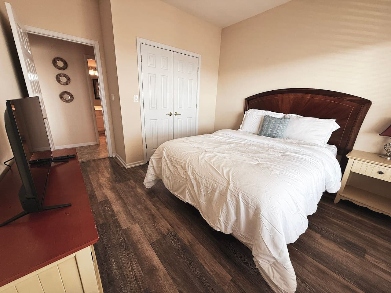 Recharge in this cozy bedroom featuring a plush queen bed, soft linens, and a calm, inviting atmosphere.