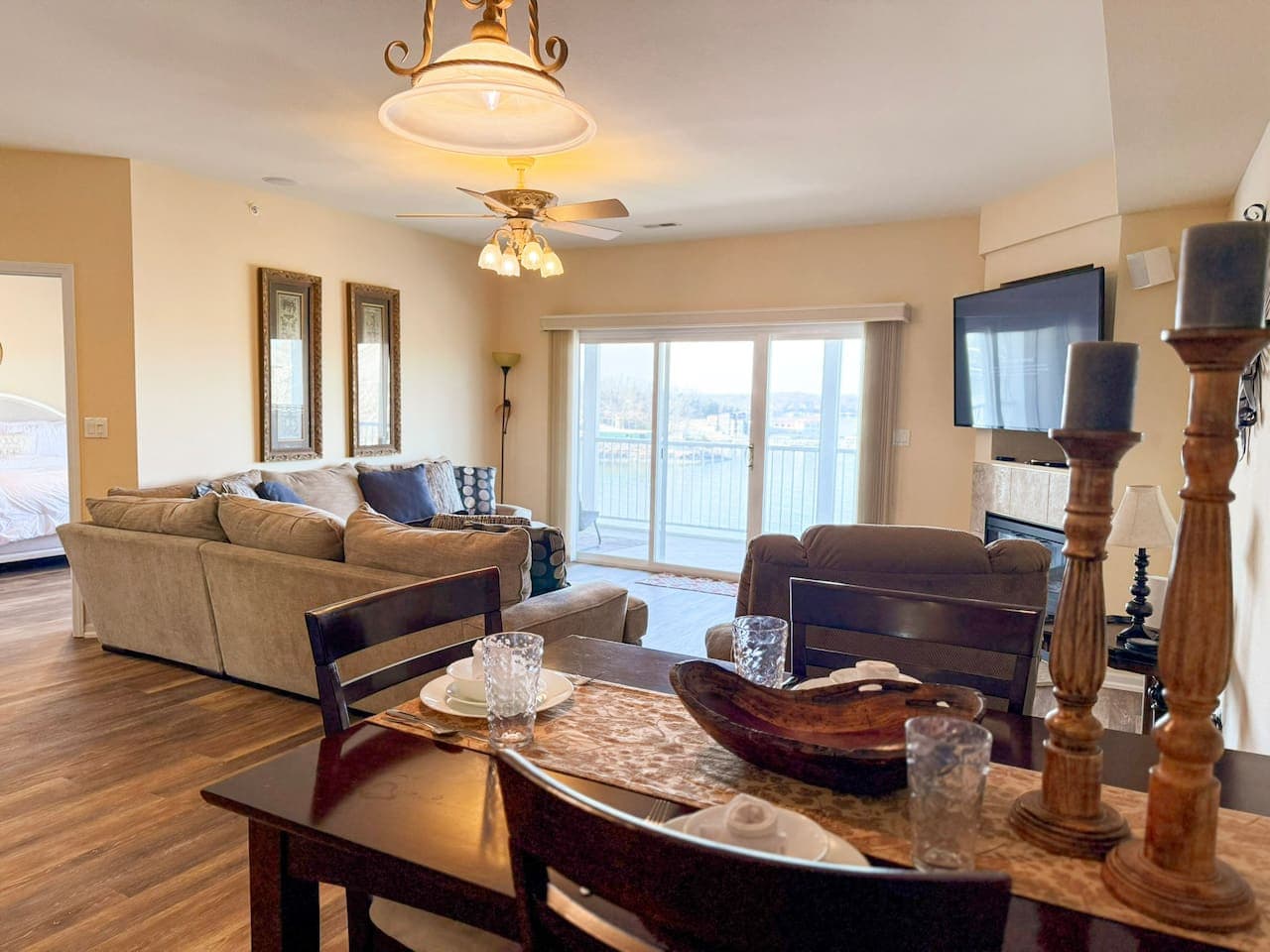 Gather and unwind in this bright open-concept living and dining space with lake views, designed for comfort and connection.