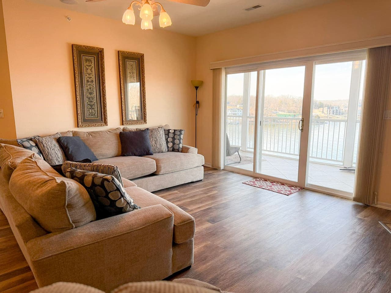 Soak in the comfort of this bright, open living space with lake-view sliding doors, perfect for relaxing after a day on the water.