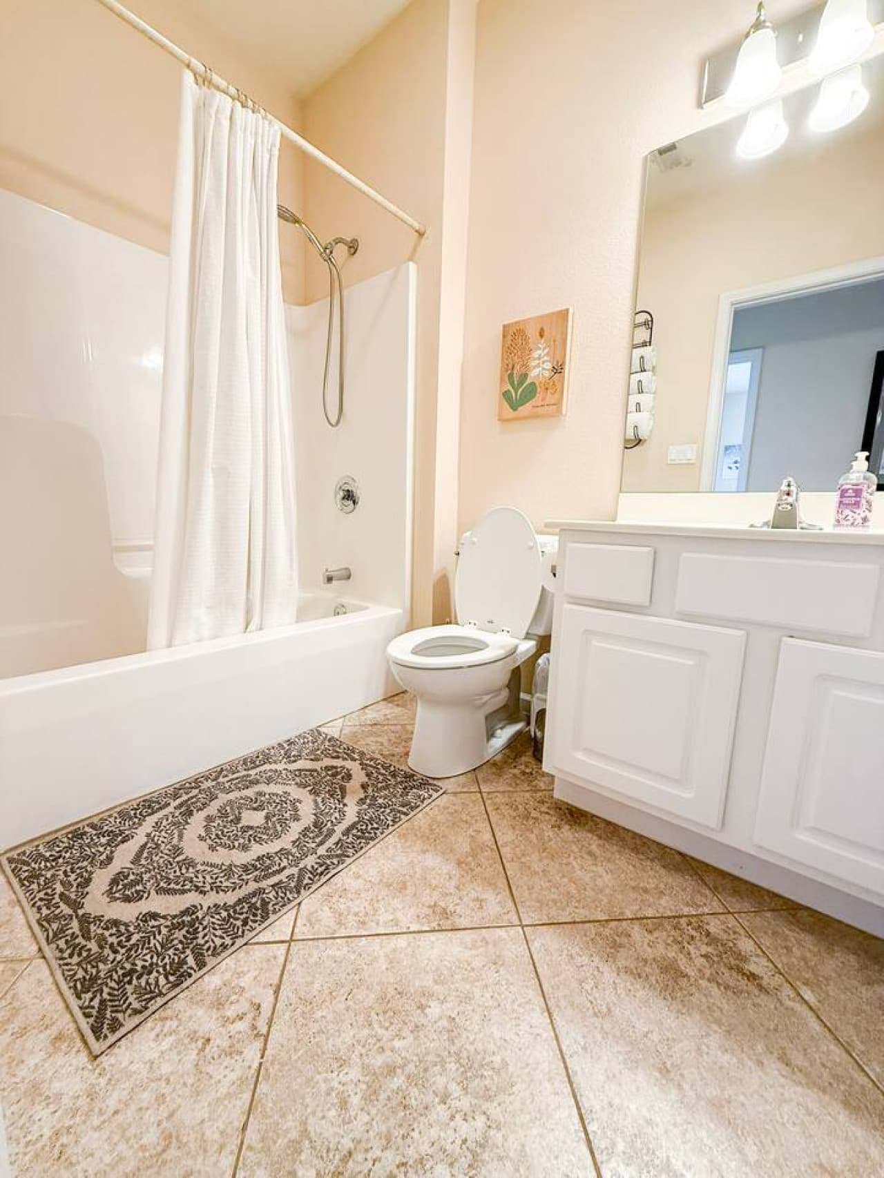 Refresh in this clean, well-appointed bathroom with a full tub/shower and modern vanity, perfect after a day on the lake.