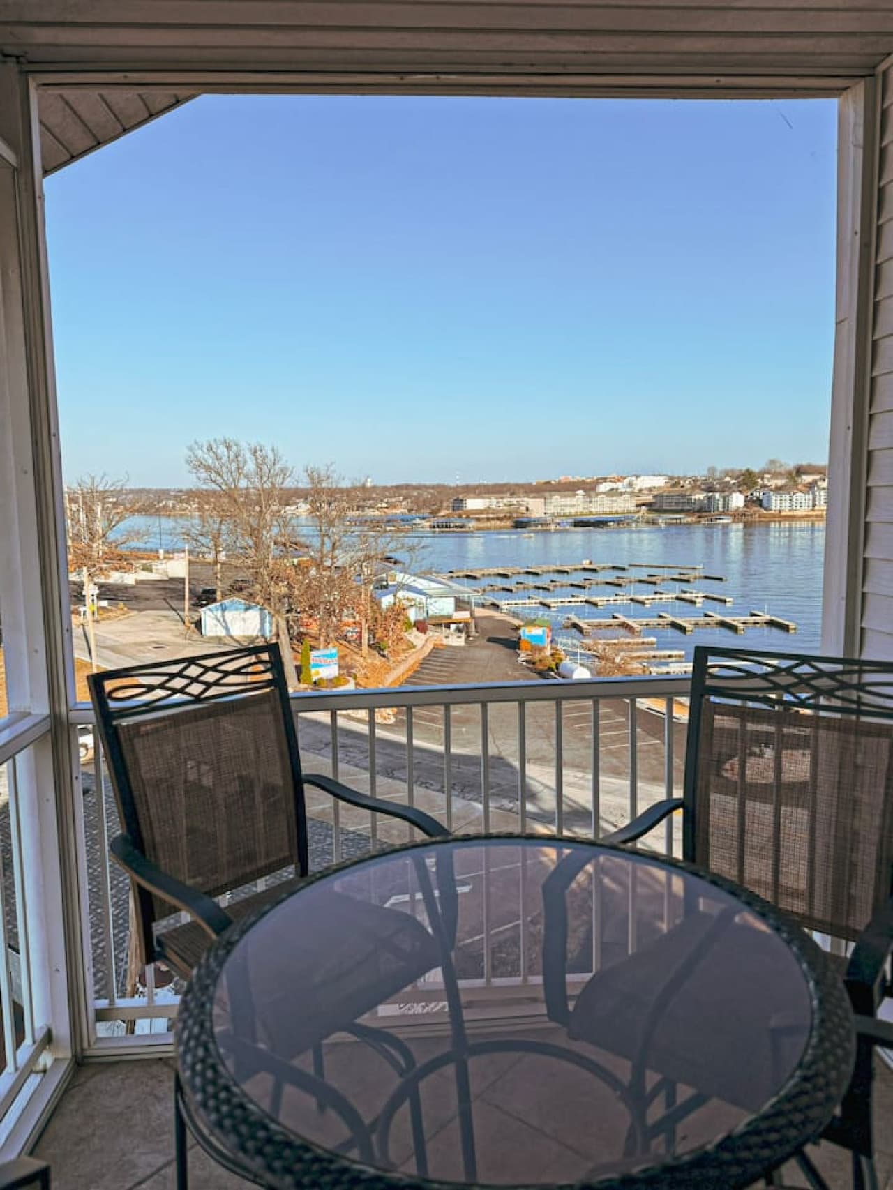 Step out onto the private balcony with sweeping lake and marina views, perfect for morning coffee or sunset drinks.
