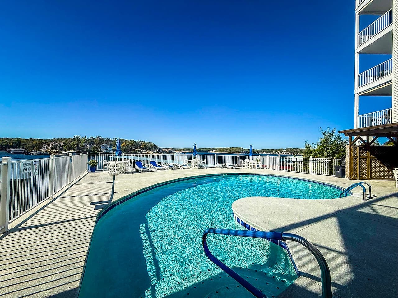 Take a refreshing dip in the sparkling outdoor pool with lake views, perfect for sunny days and relaxing afternoons.