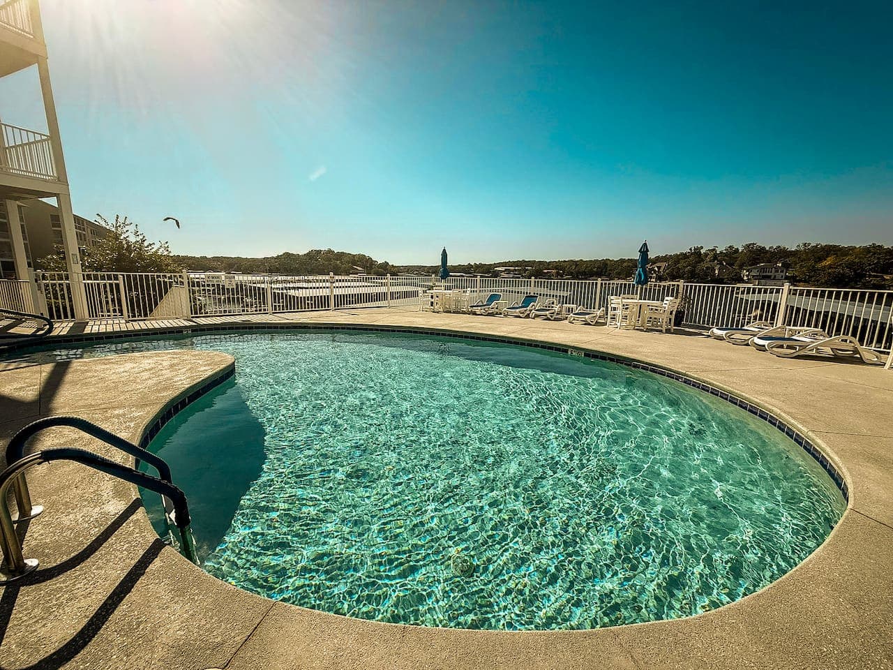 Cool off at the sparkling lakefront pool with panoramic water views, perfect for sunny days and relaxing swims.