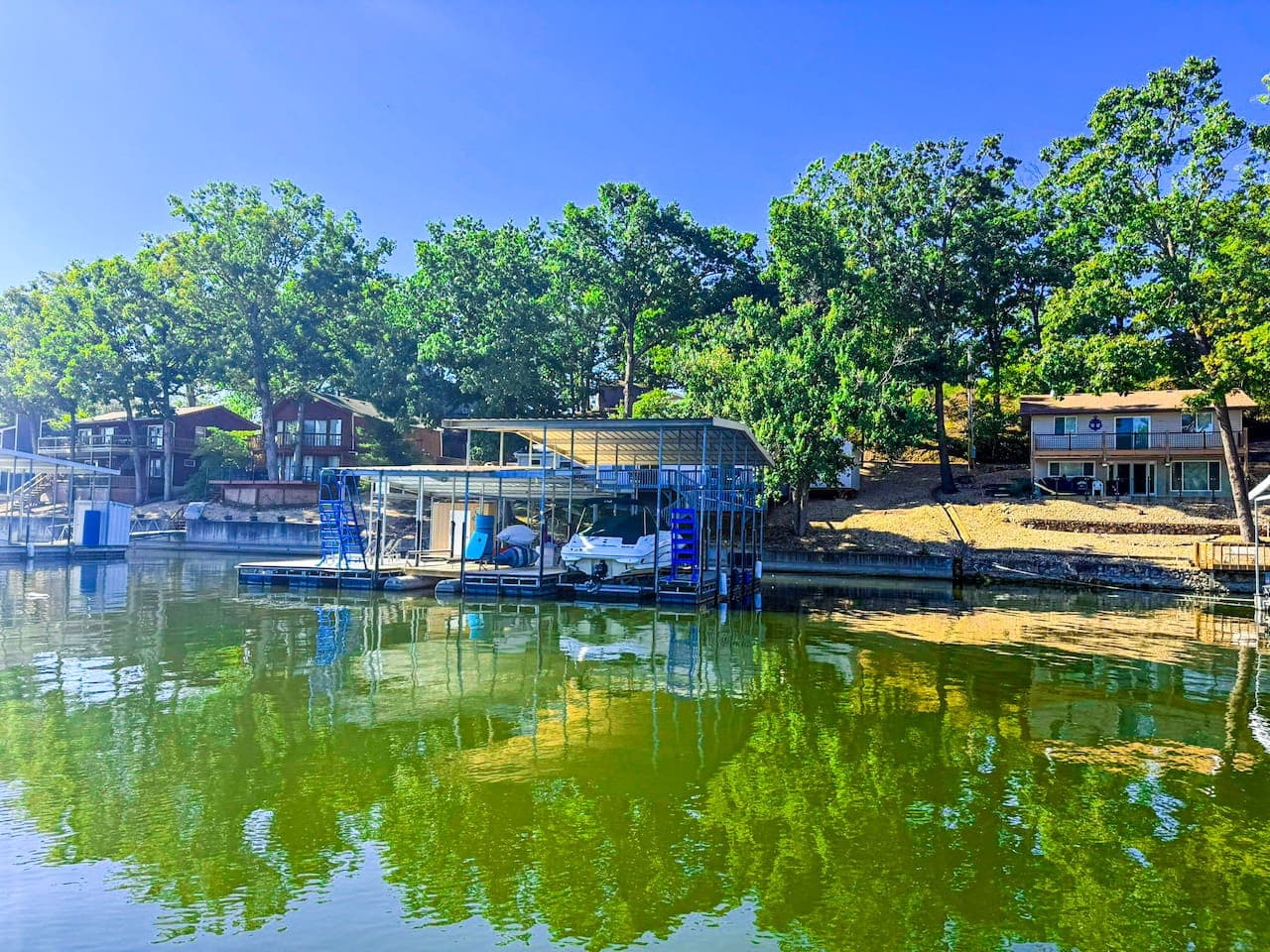 View of dock and house from water.