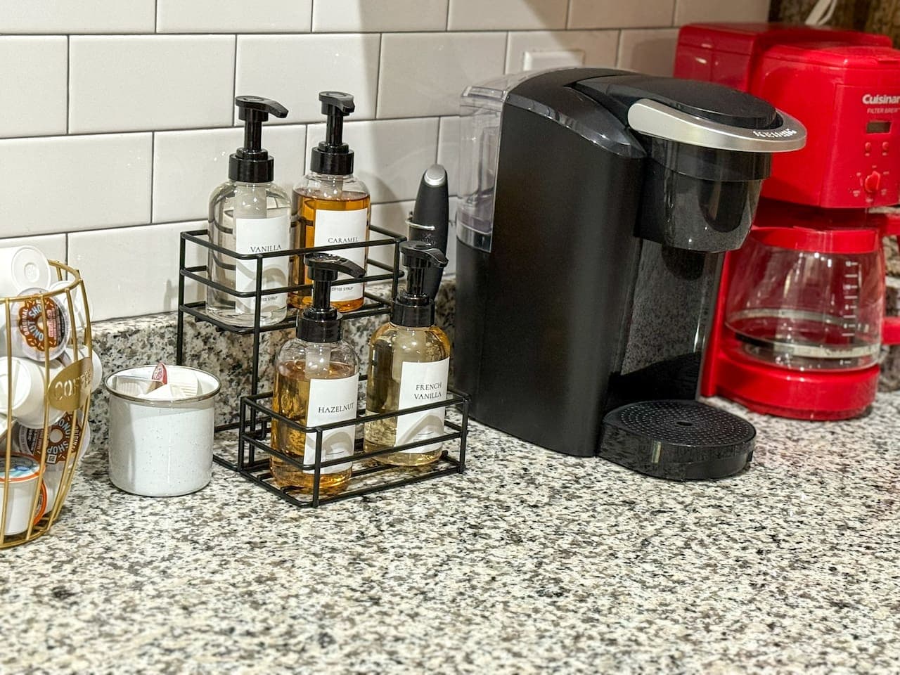 Coffee nook with both a Keurig and drip coffee maker, a variety of pods and grounds, and charming accents—everything you need for the perfect brew