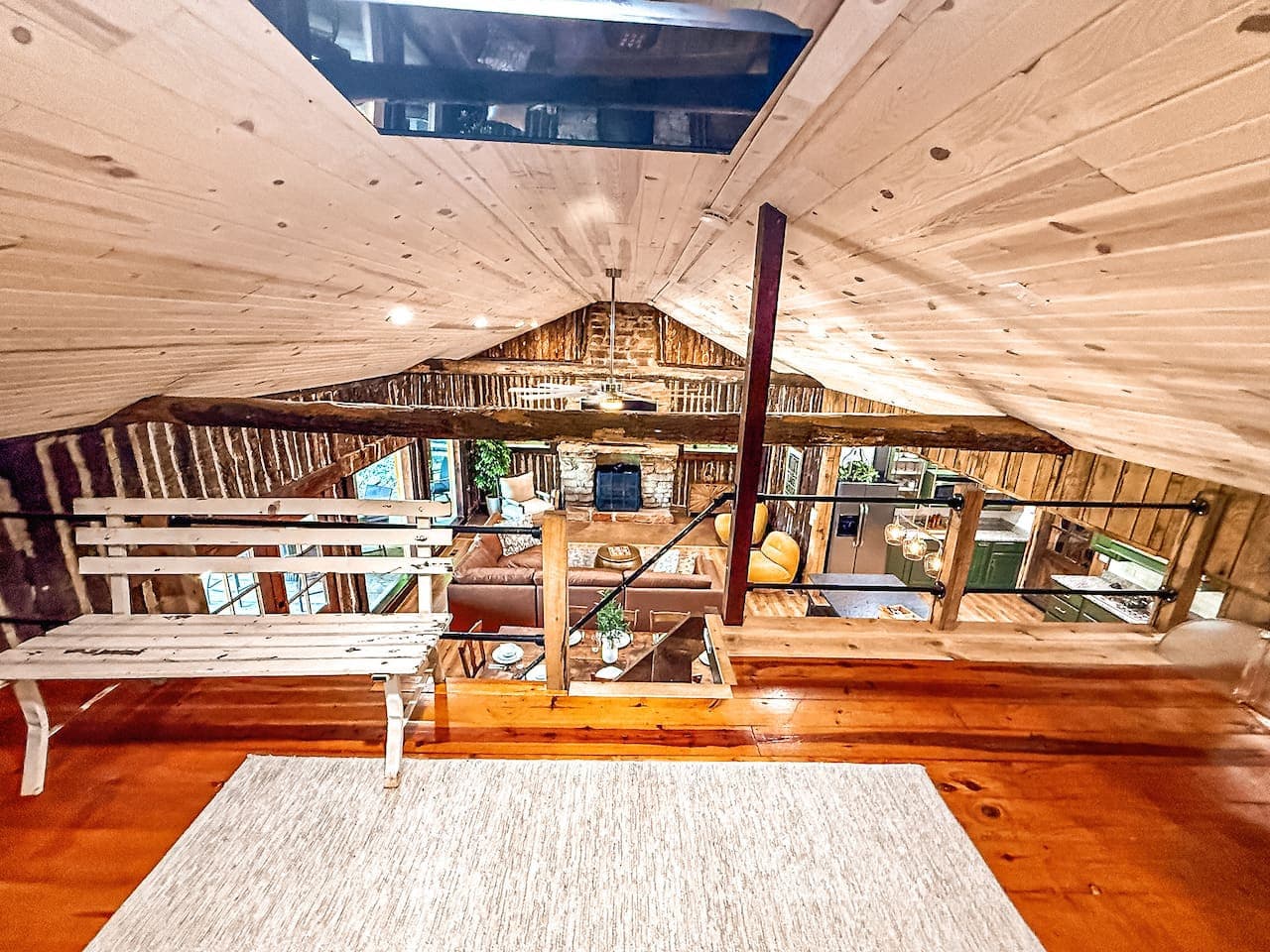 Cozy loft with a beautiful view of the living and dining areas—perfect for relaxing or watching the fun unfold below.
