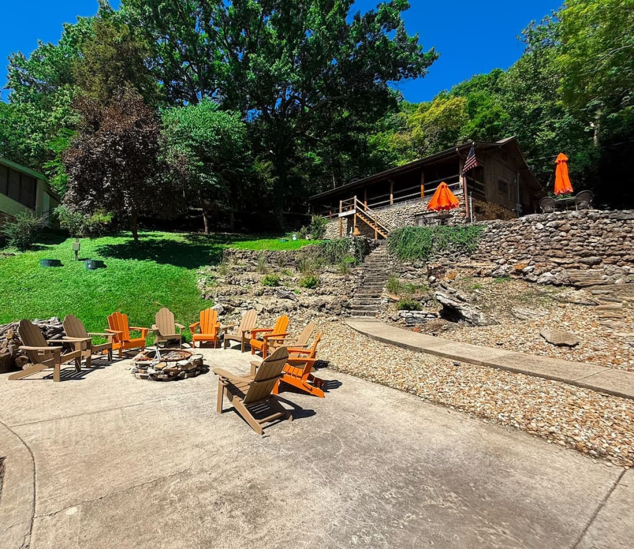 The warmth of the fire meets the charm of rustic wood seating—your favorite spot to unwind after a lake day.