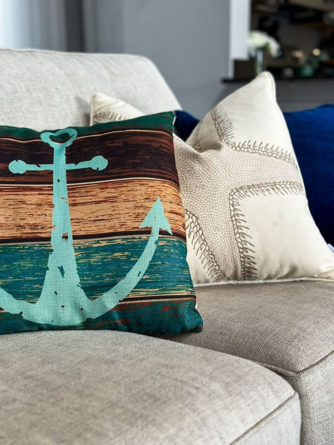 A decorative anchor pillow pairs perfectly with the nautical-inspired room theme.