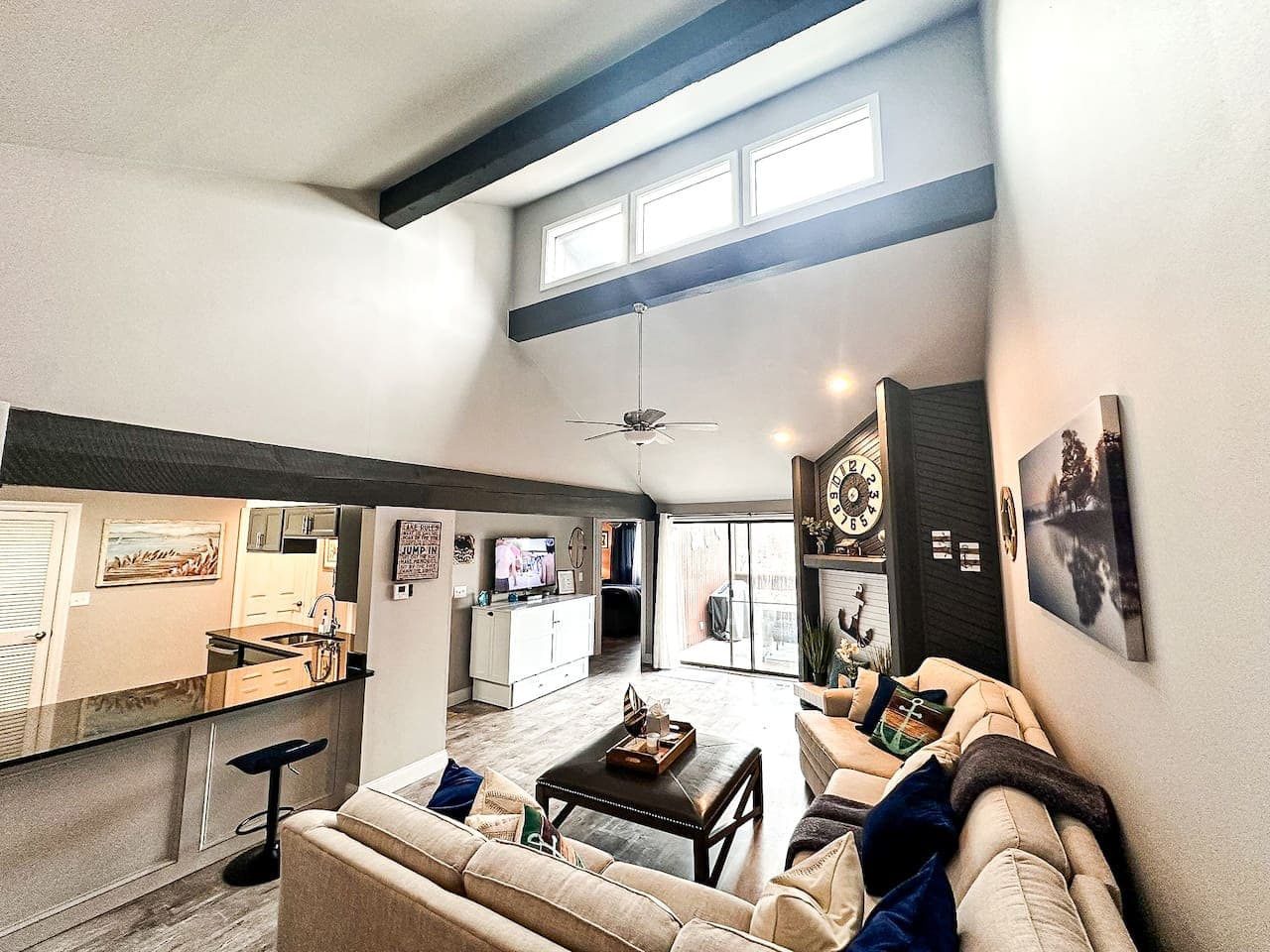 The open-plan living space offers a blend of comfort and style, ideal for your lake getaway.