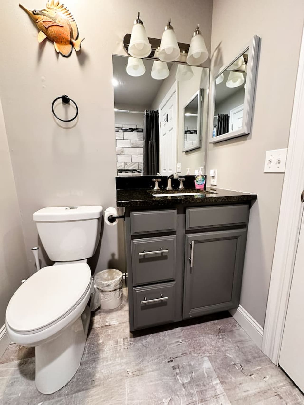 Stylish vanity and mirror in the master bathroom, complete with ample storage space.