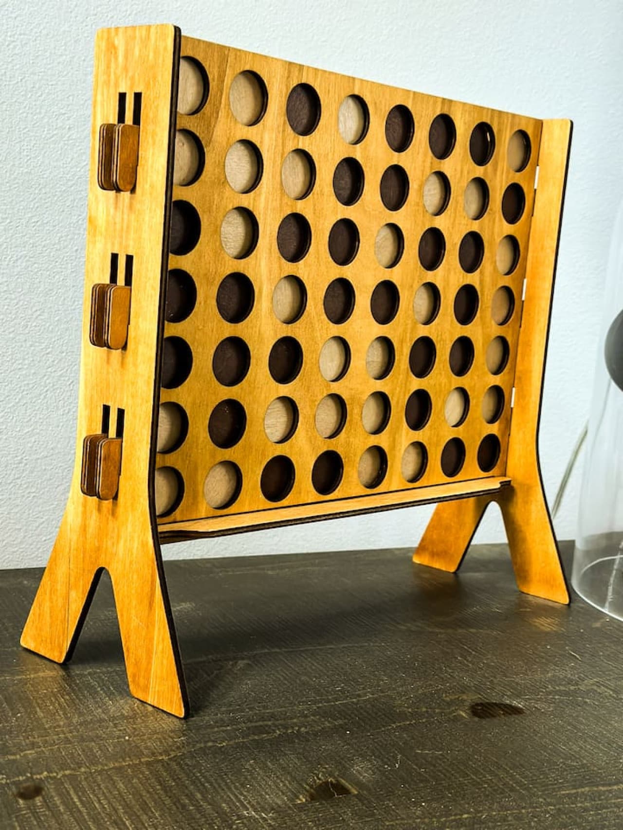 A classic wooden Connect Four game set, perfect for family entertainment.
