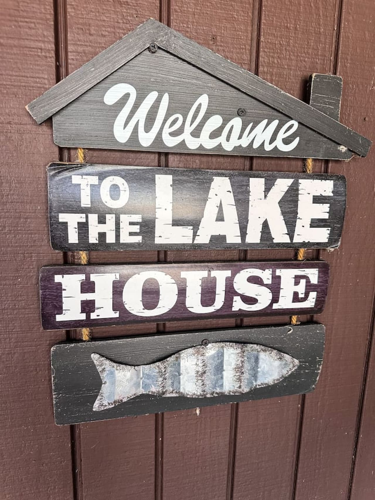 A warm "Welcome to the Lake House" sign greets you upon arrival.