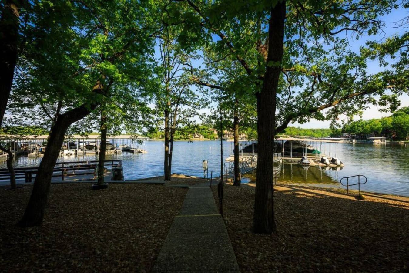 Take a walk down to the lake and access the dock, surrounded by beautiful trees.
