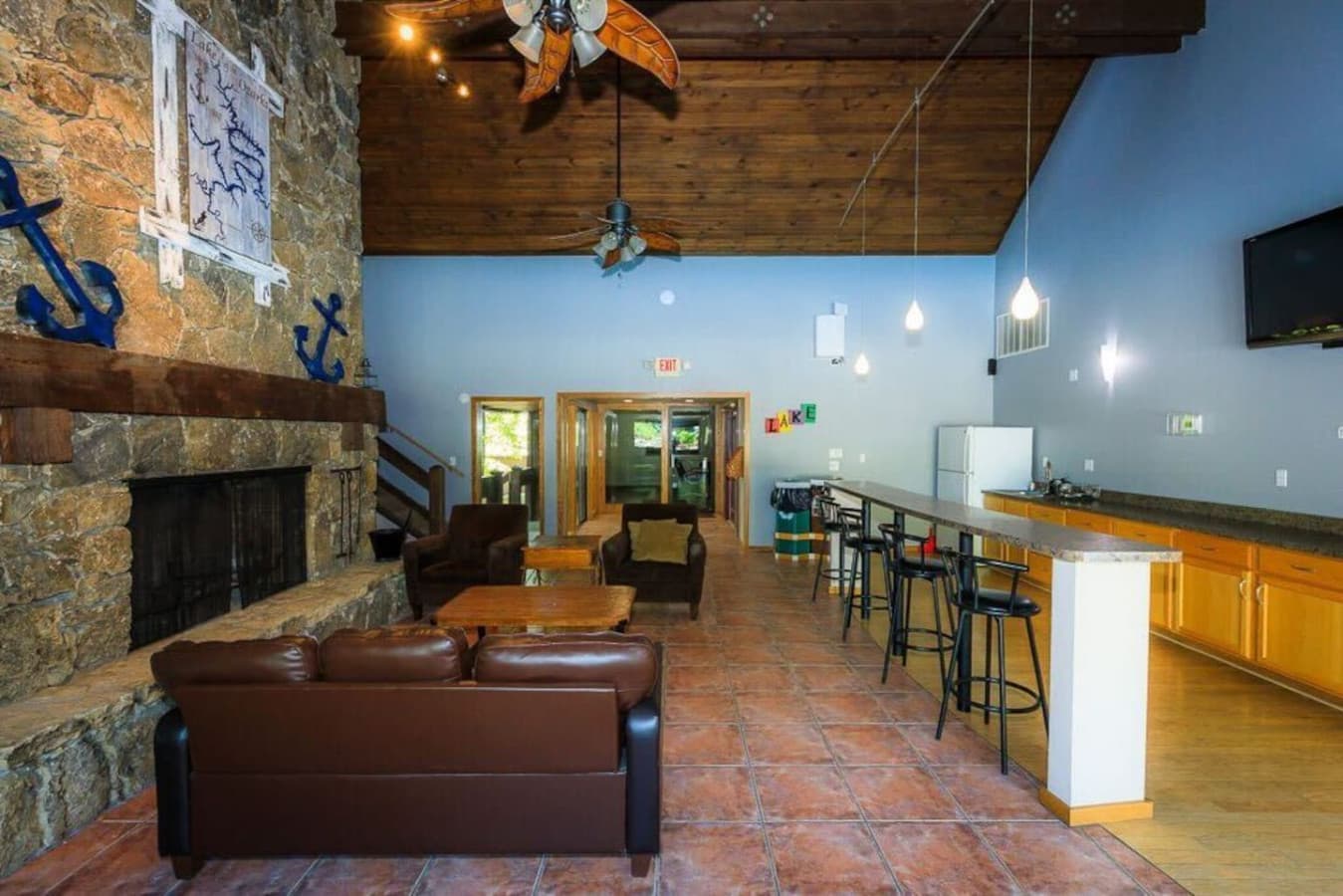 Perfect for socializing, this area features a bar, seating, and a cozy atmosphere.