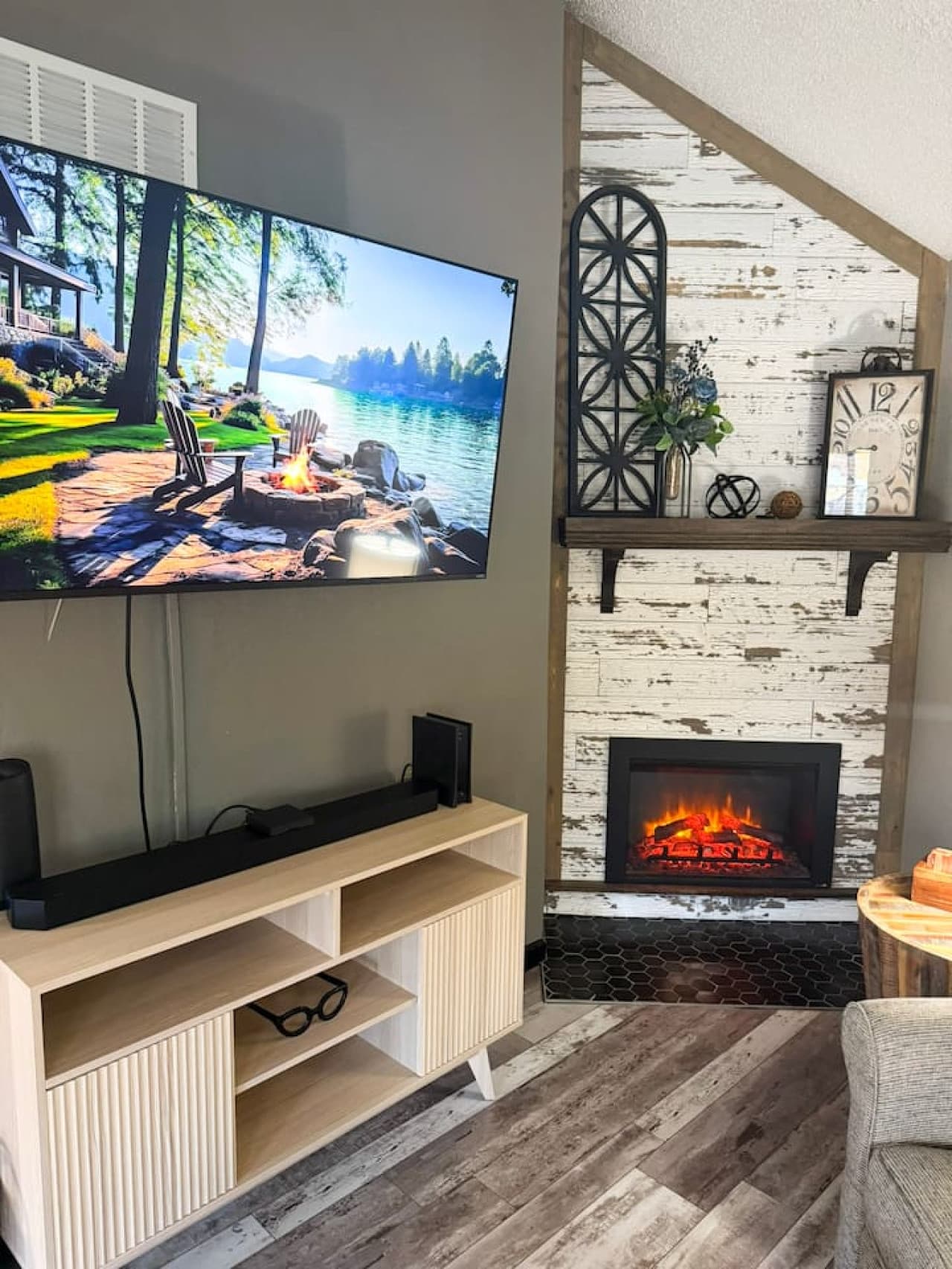 Cozy living space with a flat-screen TV, electric fireplace, and rustic accents for relaxing nights in.